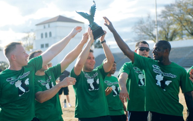 Spyder Monkey Jonathan Theye holds the painted-green eagle trophy the team won March 11 after defeating  Los Conquistadores  10-7 in the Maneuver Captains’ Career Course Mega Bowl No. 6 at Doughboy Stadium.  The Spyder Monkeys closed the regular seas...