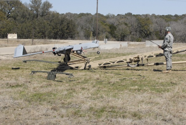 FORT HOOD, Texas-A Soldier assigned to the Alpha Company's Tactical Unmanned Aerial System, 4th Brigade Special Troops Battalion, 1st Cavalry Division prepares to launch an unmanned aerial vehicle during the UAV training at Landing Strip Cold...