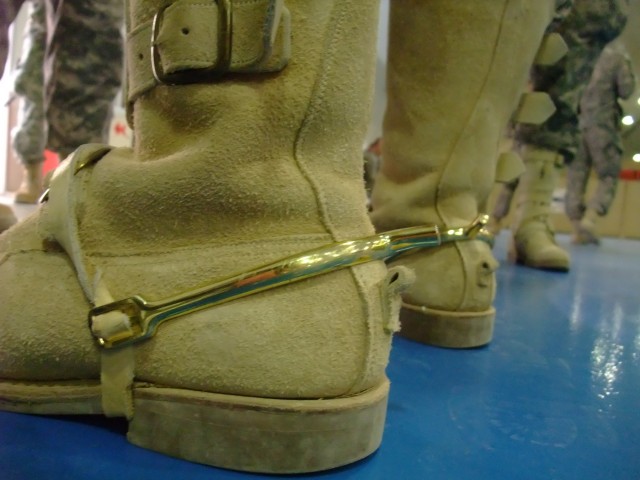 CONTINGENCY OPERATING LOCATION Q-WEST, Iraq -In true Cavalry fashion, wearing spurs and Stetsons, 1st Squadron, 278th Armored Cavalry Regiment Troopers attend the Transfer Of Authority ceremony between incoming 1st Squadron, 278th Armored Cavalry...