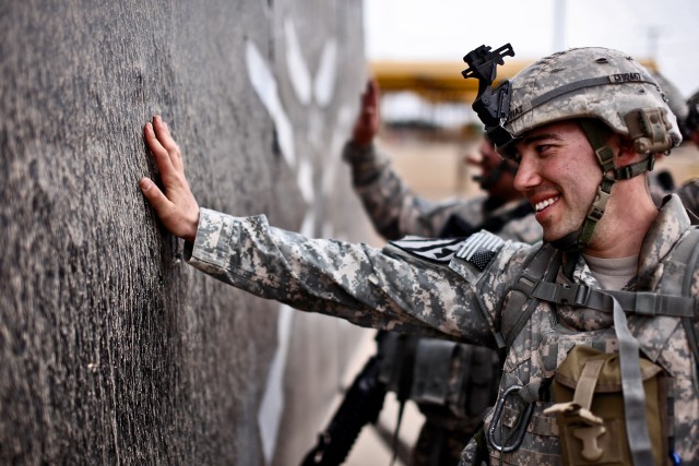 CAMP TAJI, Iraq - Happy to complete a grueling day-long challenge, Staff Sgt, Jesus Diaz, a squad leader from Los Angeles in Company F, 3rd Battalion, 227th Aviation Regiment, 1st Air Cavalry Brigade, 1st Cavalry Division, U.S. Division-Center,...