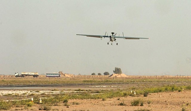 Chief Warrant Officer Greg Spalding, OH-58D Kiowa pilot and Hunter UAS mission controller, operates a Hunter Unmanned Aircraft System from the mission control center at Contingency