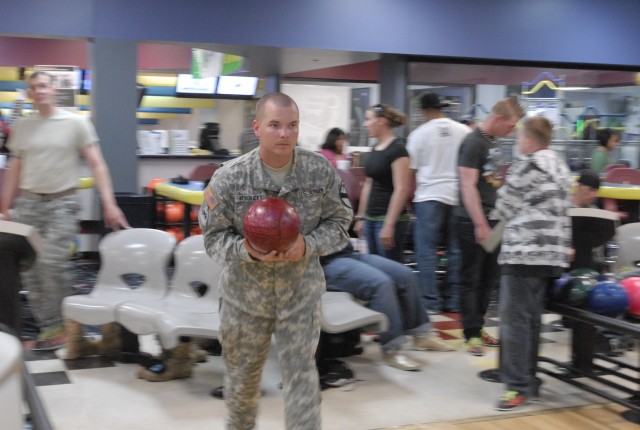 FORT HOOD, Texas- Spc. Clayton Hendricks, an unmanned aerial system maintainer assigned to A Company, 4th Brigade Special Troops Battalion, 4th Brigade Combat Team, 1st Cavalry Division, prepares to bowl during a unit event at Phantom Warrior...
