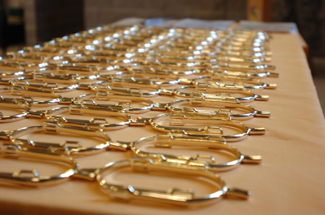FORT HOOD, Texas - 'Golden Spurs' align a table before 89 Soldiers from the Division G2 section received them, March 25, at Belton Lake Recreational Area. Golden Spurs are award to Cavalry troopers for successfully completing a year-long...
