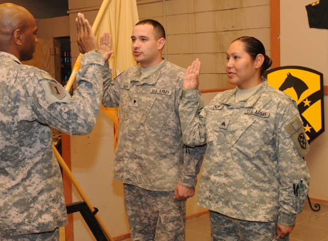Married-couple Spc. Samuel Baker, a communications system support specialist and  his wife, Sgt. Raquel Baker, an automated logistics specialist, both with Headquarters Company, 15th Special Troops Battalion, 15th Sustainment Brigade, 13th...