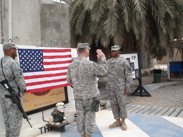 CAMP LIBERTY, Iraq-(Left to Right) Brig. Gen. Thomas S. Vandal, the deputy commanding general, 3d Infantry Division and United States Division - North, reenlists Sgt. Raphael Williams, a native of the Virgin Islands and a human resources...