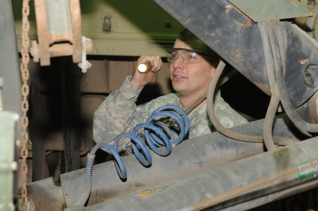 Spc. Jerry E. Howe, a driver with the 3666th Support Maintenance Company recovery team out of Phoenix, 541st Combat Sustainment Support Battalion, 15th Sustainment Brigade, 13th Sustainment Command (Expeditionary) and a Peoria, Ariz., native, perform...