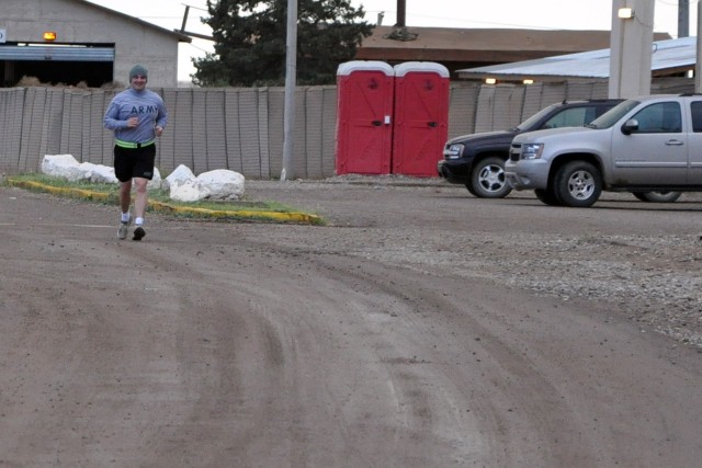 Capt. Joshua Southworth, an operations officer with the 15th Sustainment Brigade, 13th Sustainment Command (Expeditionary), begins the last 10 miles of a 30-mile run on his 30th birthday March 28 at Contingency Operating Location Q-West, Iraq. (U.S. ...