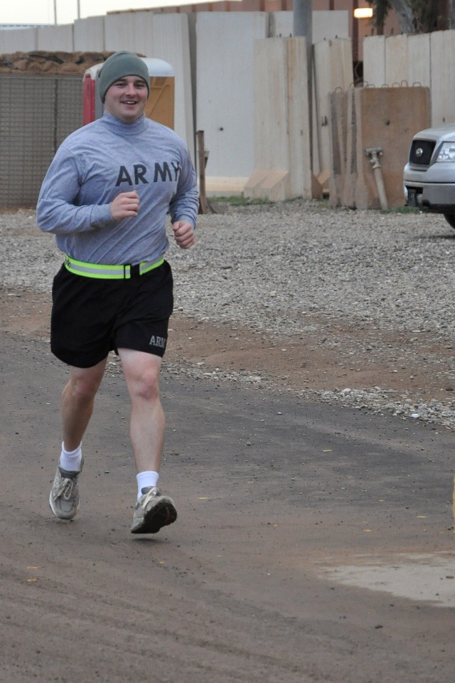 Capt. Joshua Southworth, an operations officer with the 15th Sustainment Brigade, 13th Sustainment Command (Expeditionary), begins the last 10 miles of a 30-mile run on his 30th birthday March 28 at Contingency Operating Location Q-West, Iraq. (U.S. ...