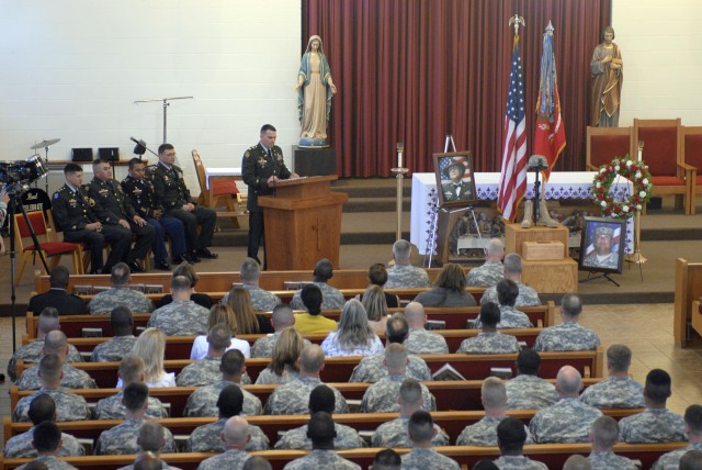FORT HOOD, Texas-Soldiers assigned to the 4th Brigade Combat Team, 1st Cavalry Division, join together to remember Spc. Erik George-Vega during his memorial ceremony at the Fort Hood's Operation Iraqi Freedom Veteran's Chapel on April 1. The 30-year-...