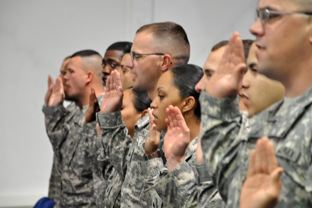 Noncommissioned officers with the 15th Sustainment Brigade recite the Charge of the Noncommissioned Officer during an induction ceremony here March 31. During the ceremony, 48 NCOs were inducted into the Army's NCO corps. (U.S. Army photo by Staff...