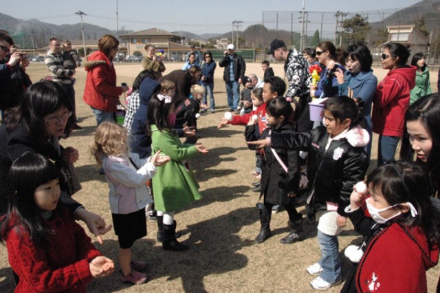 Children play with Easter eggs to celebrate Month of the Military Child on Red Cloud and Casey