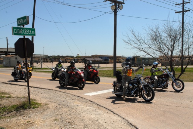 FORT HOOD, Texas-A group of riders make a quick survey of an intersection before taking a turn during a safety ride on Fort Hood, Texas, March 29. The riders were part of 4th Squadron, 9th Cavalry Regiment, 2nd Brigade Combat Team, 1st Cavalry...