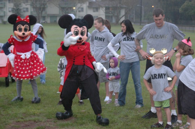 PT in the Park: Children and parents laugh, dance, run and jump through the rain