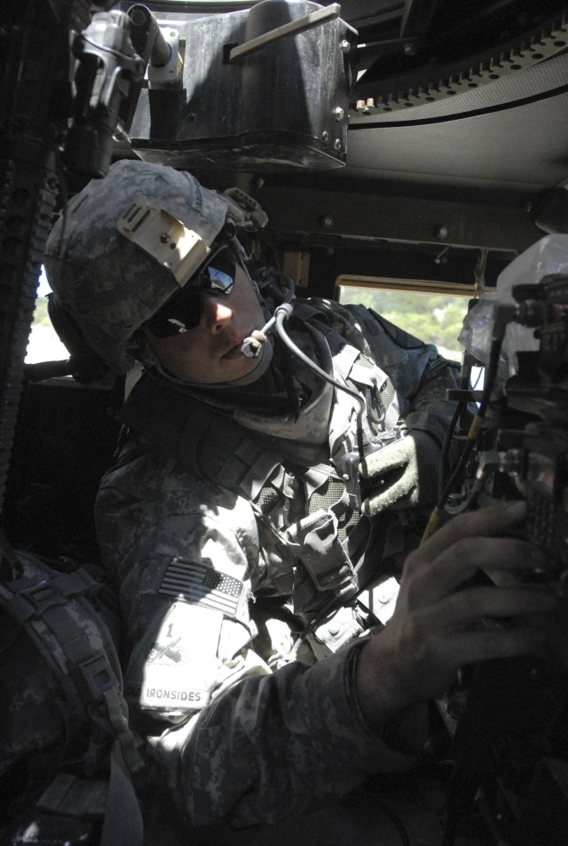 FORT HOOD, Texas-Spc. James Albada-O'Malley, a tank gunner assigned to 2nd Battalion, 12 Cavalry Regiment, 4th Brigade Combat Team, 1st Cavalry Division, performs a system check on his radio equipment prior to convoying out to the Blackwell...