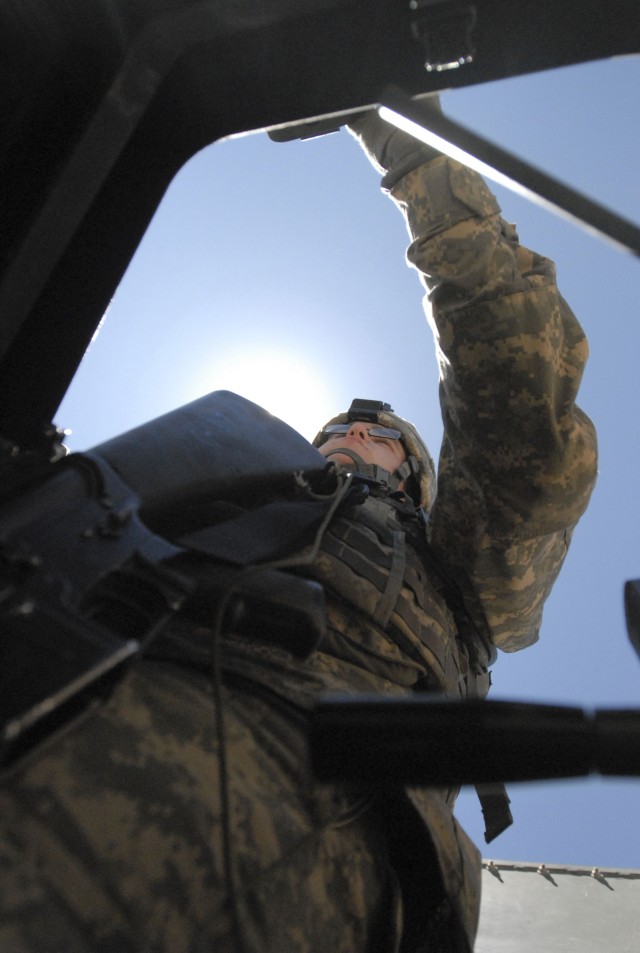 FORT HOOD, Texas-Spc. Kelvin Williams, a tank gunner assigned to 2nd Battalion, 12 Cavalry Regiment, 4th Brigade Combat Team,1st Cavalry Division prepares to engage targets during his brigade's long range marksmanship training at the Blackwell...