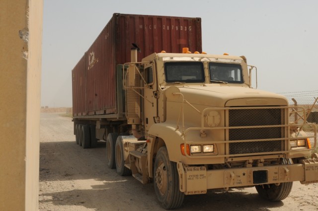 A Soldier with the 611th Seaport Operations Company out of Fort Eustis, Va., 541st Combat Sustainment Support Battalion, 15th Sustainment Brigade, 13th Sustainment Command (Expeditionary) drives through the Savi Signpost system, which helps the...
