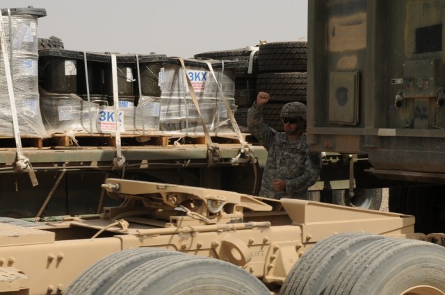 Sgt. Jackie D. Womack, the trailer transfer point noncommissioned officer in charge with the 611th Seaport Operations Company out of Fort Eustis, Va., 541st Combat Sustainment Support Battalion, 15th Sustainment Brigade, 13th Sustainment Command...