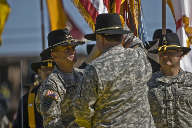 FORT HOOD, Texas-Maj. Gen. Daniel Allyn (left) receives the 1st Cavalry Division's Colors from reviewing officer, Gen. Charles Campbell, signifying his role as the division's new commander. Allyn, from Berwick, Md., comes to the 1st Cav. Div. from...