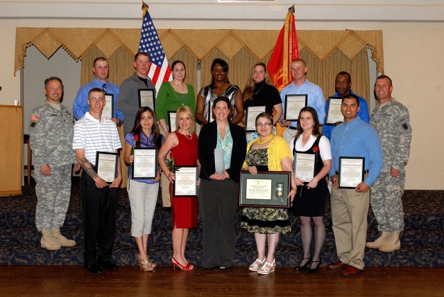 FORT HOOD, Texas-Soldiers and civilians from the 589th Brigade Support Battalion display their volunteer awards at the annual Volunteer Recognition Ceremony, April 15, at Club Hood. Both Soldier and civilian volunteers were honored for donating...