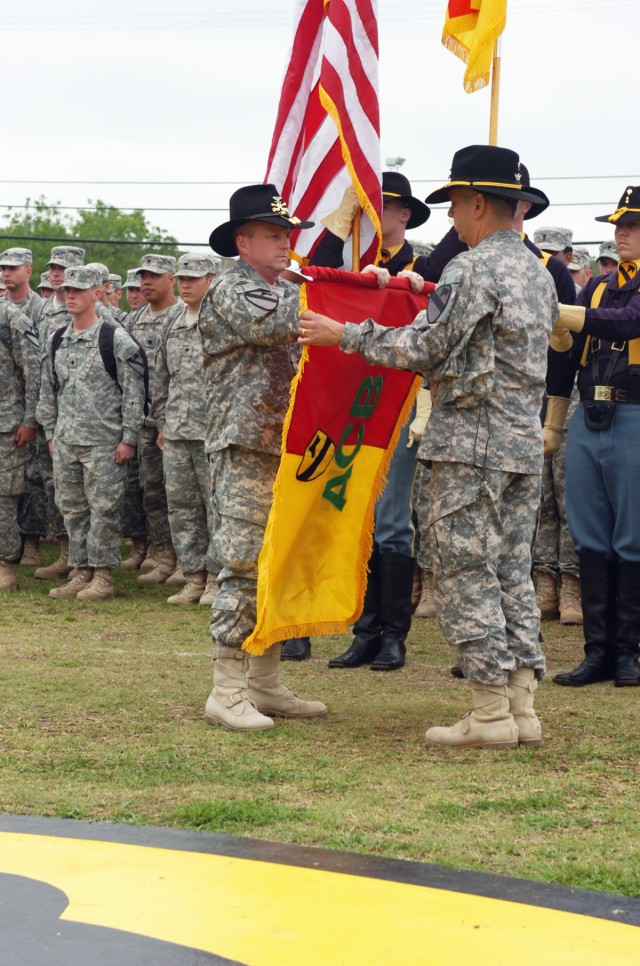 FORT HOOD, Texas-Surrounded by a formation of returning 1st Air Cavalry Brigade Soldiers and the 1st Cavalry Division honor guard, Col. Douglas Gabram, from Cleveland, commander, 1st ACB, 1st Cav. Div., uncases the brigade's colors with Command Sgt. ...