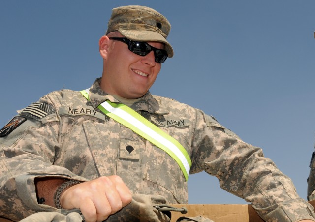 Spc. John Neary, a truck driver for 733rd Transportation Company, 15th Special Troops Battalion, 15th Sustainment Brigade, 13th Sustainment Command (Expeditionary), and Shamokin, Penn., places medical kits into a palletized box for turn in to a...
