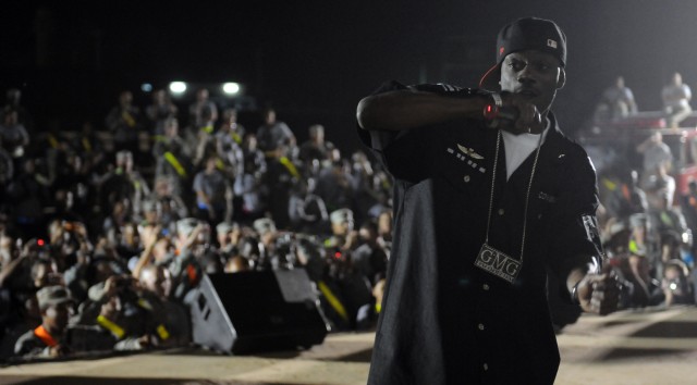 Rap-recording artist and Chicago native B-Hype performs with Twista at a show for the troops in the outdoor theater here April 14 on the second stop of a five-stop tour. (U.S. Army photo by Staff Sgt. Matthew C. Cooley, 15th Sustainment Brigade...