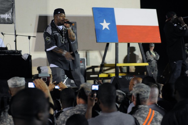 Rap-recording artist and Chicago native Twista performs for service members at a show for the troops in the outdoor theater here April 14 on the second stop of a five-stop tour. (U.S. Army photo by Staff Sgt. Matthew C. Cooley, 15th Sustainment...