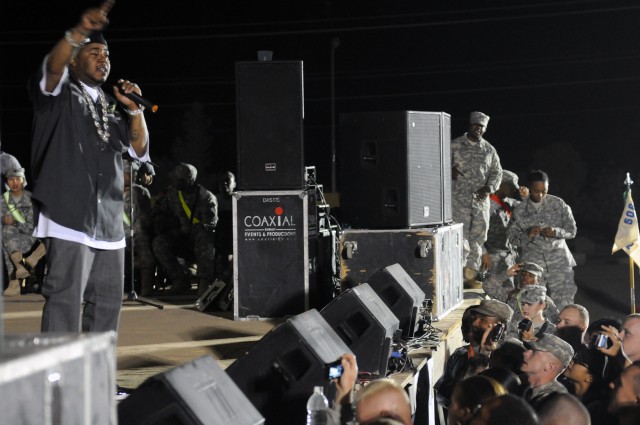 Rap-recording artist and Chicago native Twista performs for service members at a show for the troops in the outdoor theater here April 14 on the second stop of a five-stop tour. (U.S. Army photo by Staff Sgt. Matthew C. Cooley, 15th Sustainment...