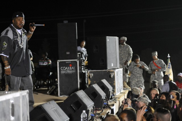 Rap-recording artist and Chicago native Twista performs for service members at a show for the troops in the outdoor theater here April 14 on the second stop of a five-stop tour. (U.S. Army photo by Staff Sgt. Matthew C. Cooley, 15th Sustainment...