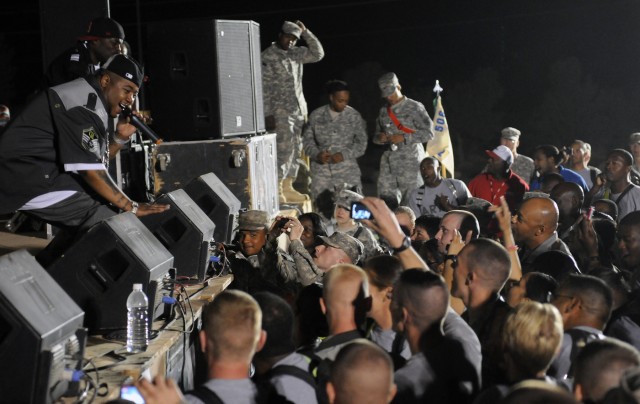 Rap-recording artists and Chicago natives Twista and B-Hype perform for service members at a show for the troops in the outdoor theater here April 14 on the second stop of a five-stop tour. (U.S. Army photo by Staff Sgt. Matthew C. Cooley, 15th...