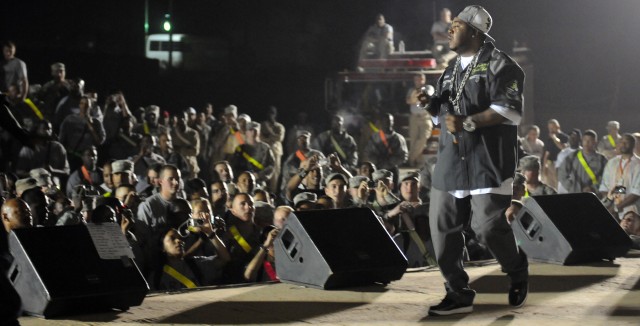Rap-recording artist and Chicago native Twista performs for service members at a show for the troops in the outdoor theater here April 14 on the second stop of a five-stop tour. (U.S. Army photo by Staff Sgt. Matthew C. Cooley, 15th Sustainment...