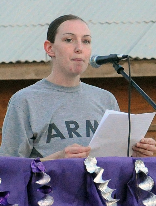 Pvt. Megan Moffatt, a College Station, Texas native and mayor-cell help desk clerk for 15th Special Troops Battalion, 15th Sustainment Brigade, 13th Sustainment Command (Expeditionary), reads her award-winning essay before a 5 kilometer walk to raise...