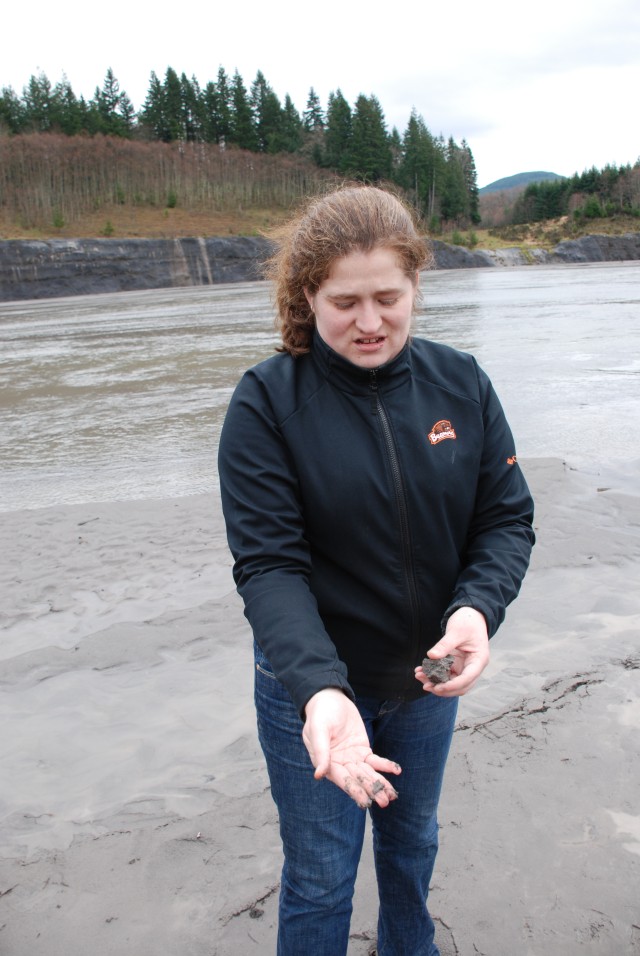 Alison Burcham, Mount St. Helens project manager, holds up some sediment