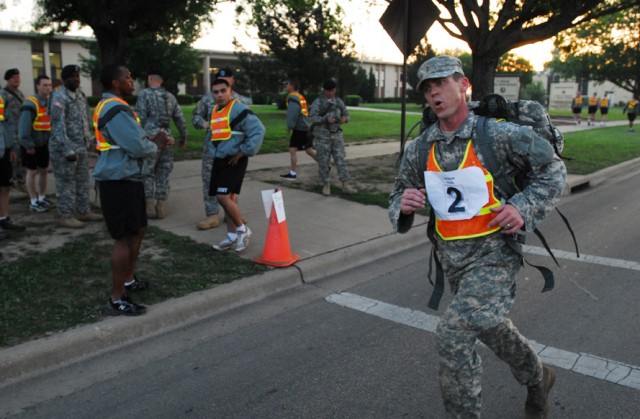 FORT HOOD, Texas-2nd Lt. Mike Ezell, a Wichita Falls, Texas native and a platoon leader with 2nd Special Troops Battalion, 2nd Brigade Combat Team, 1st Cavalry Division, completes the last steps of a three-mile rucksack march on Fort Hood, Texas,...