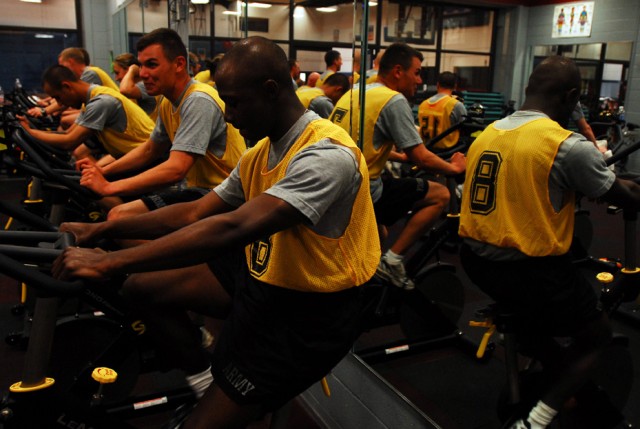 FORT HOOD, Texas-Pfc. Jeremy Lauderdale, an Atlanta native and a signal support specialist with 2nd Special Troops Battalion, 2nd Brigade Combat Team, 1st Cavalry Division, peddles hard as a stop watch ticks away 25 minutes during a triathlon...