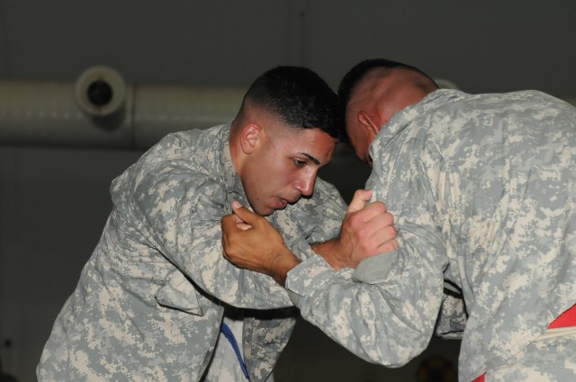 Pfc. Ismael Roman, a heavy equipment operator with the 37th Engineer Battalion out of Fort Bragg, N.C., 36th Engineer Brigade and an Arecibo, Puerto Rico, native, and Spc. Anthony Mendez, a shower, laundry and renovations specialist with the 263rd Qu...