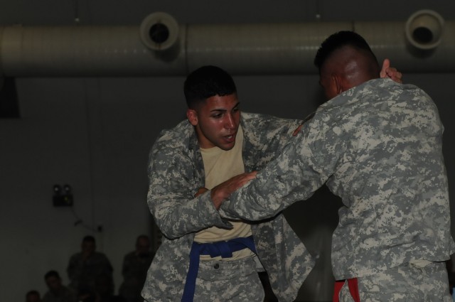 Pfc. Ismael Roman, a heavy equipment operator with the 37th Engineer Battalion out of Fort Bragg, N.C., 36th Engineer Brigade and an Arecibo, Puerto Rico, native, and Spc. Anthony Mendez, a shower, laundry and renovations specialist with the 263rd Qu...