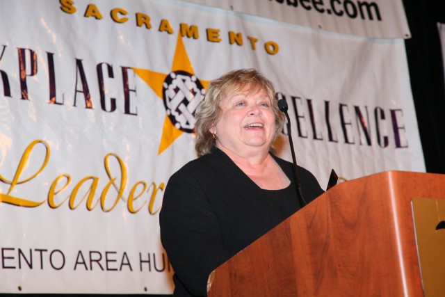 Sharon Caine, U.S. Army Corps of Engineers Sacramento DistrictAca,!a,,cs real estate division chief, accepts the award for best employer
