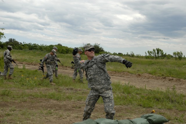 FORT HOOD, Texas-Spc. Jason Eaves, a native of Austin, Texas, practices throwing grenades during Expert Infantry Badge training, here, May 4. Assigned to the 2nd Battalion, 7th Cavalry Regiment, 4th Brigade Combat Team, 1st Cavalry Division, Eaves ho...