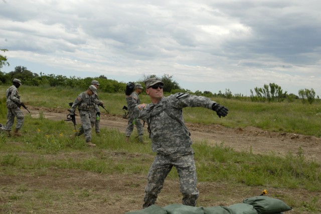 FORT HOOD, Texas-Spc. Jason Eaves, a native of Austin, Texas, practices throwing grenades during Expert Infantry Badge training, here, May 4. Assigned to the 2nd Battalion, 7th Cavalry Regiment, 4th Brigade Combat Team, 1st Cavalry Division, Eaves...