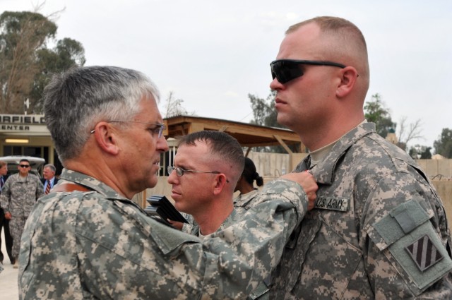 Sergeant John Z. Snell is presented the Bronze Star 