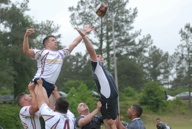 John McCormick, of the Marine Corps Air Station Cherry Point, N.C., Rugby Club, left, and Joe Strauf of the Columbus/Fort Benning Rugby Club compete in a lineout Saturday at Essebagger Field during the USA Rugby/Drash Military Club Armed Forces Champ...