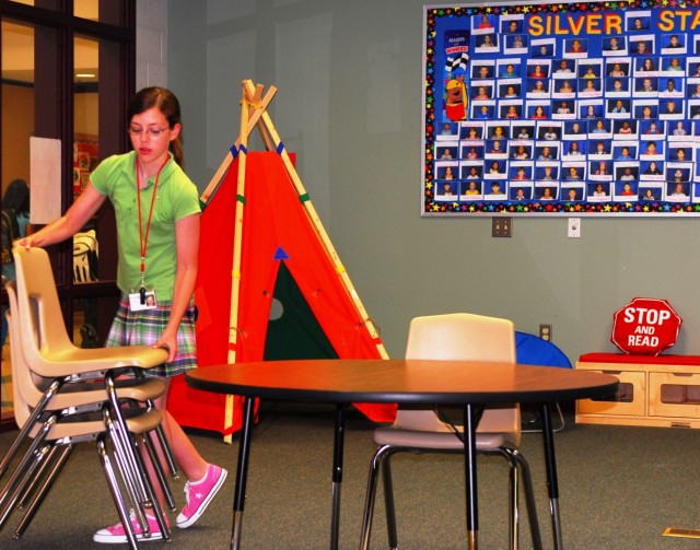 FORT HOOD, Texas-Leslie Chaffin, 12, wakes up early to help set up the library at Skipcha Elementary School in Harker Heights, Texas.  Leslie was recognized as the youth "Volunteer of the Year" for the 2nd Brigade Combat Team, 1st Cav. Div. She is...