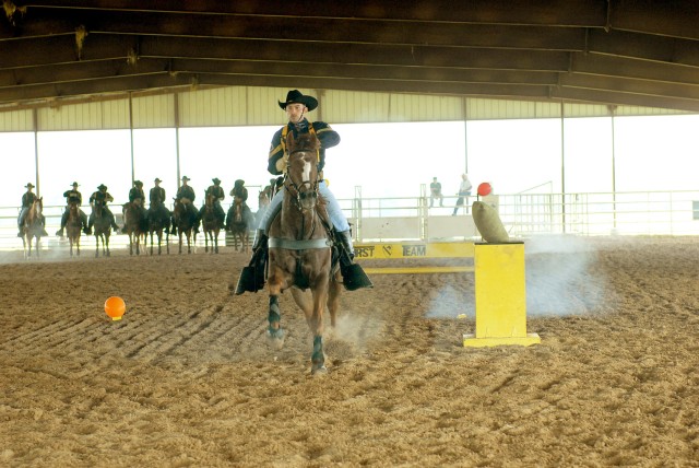 CENTERVILLE, Texas-A trooper from the 1st Cavalry Division's Horse Cavalry Detachment demonstrates his weapon skills while mounted the during annual Veteran Appreciation Day hosted by the 41st Fires Brigade and Leon County Veterans Service Office,...
