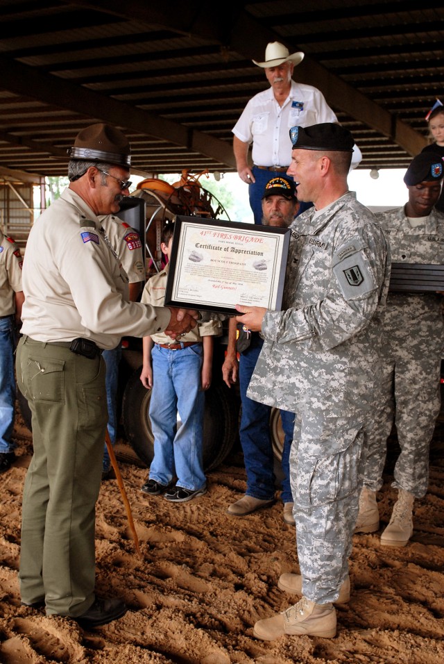CENTERVILLE, Texas-Boy Scout Troop 6335 accepts a certificate of appreciation from Col. John Thomson, commander of the 41st Fires Brigade, during the annual Veteran Appreciation Day, here, May 1. Organizations that help the community were...