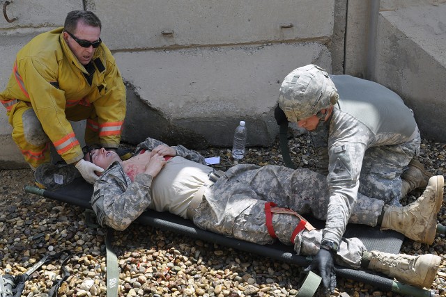 Placing casualty onto litter