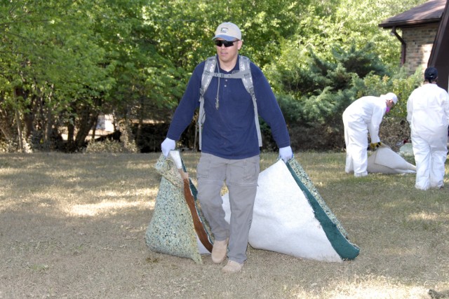 Soldiers with 101st Airborne Division help clean up flood areas