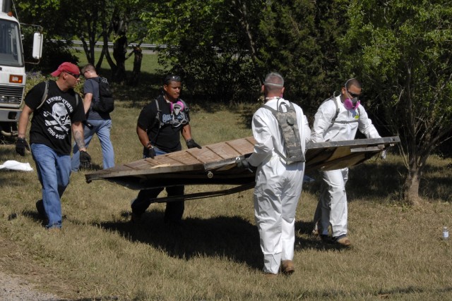 Soldiers with 101st Airborne Division help clean up flood areas