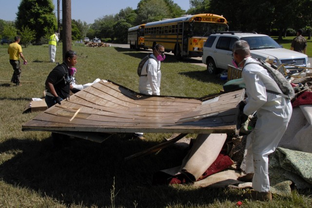 Soldiers with 101st Airborne Division help clean up flood areas