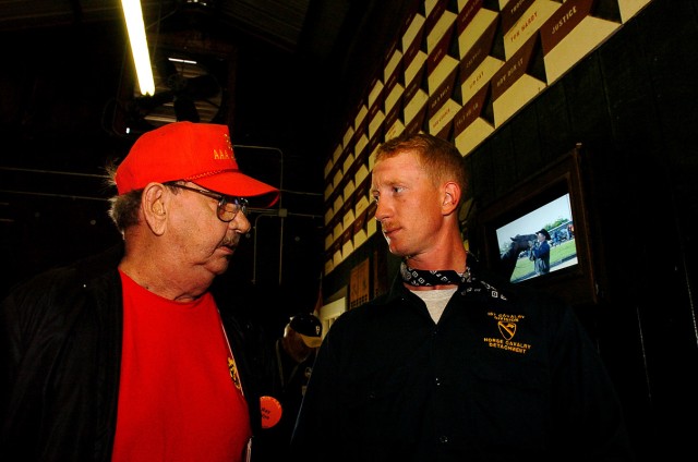 FORT HOOD, Texas-Sgt. Red Donaldson (right), a Horse Cavalry Detachment trooper from Gatesville, Texas, speaks with Ray Murray, of Wire, Ky., during the 865th Anti-Aircraft Artillery Battalion reunion April 29, at Fort Hood, Texas. Murray served...
